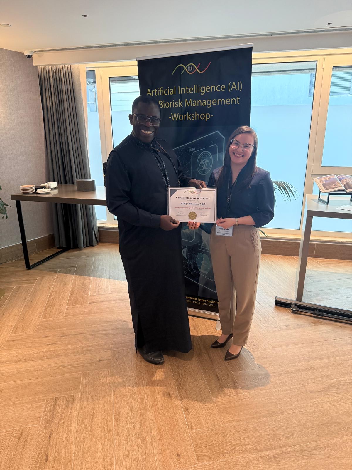 Michelle handing a certificate to a workshop participant